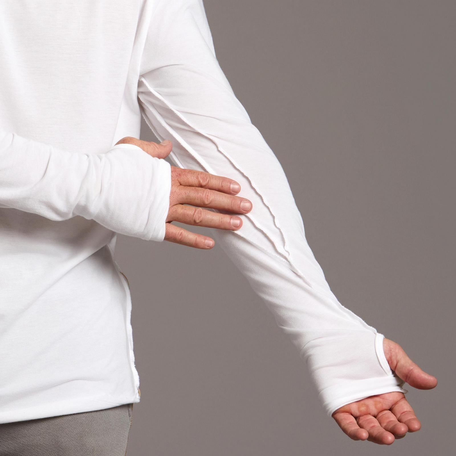 Man modeling white long-sleeve hooded tee