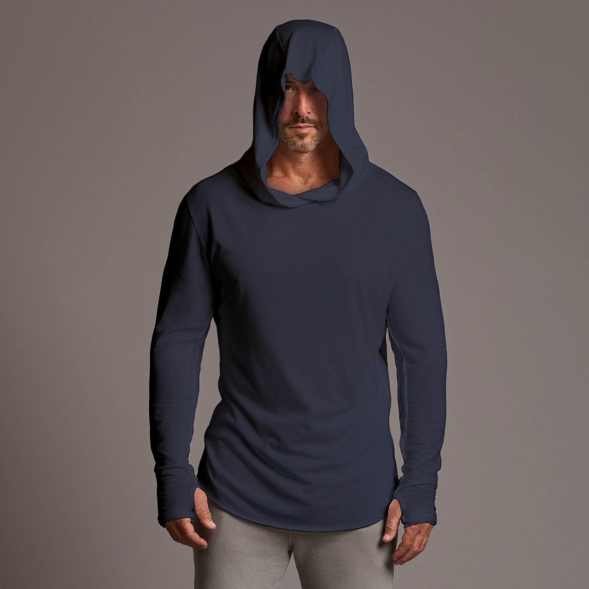 Man modeling blue long-sleeve hooded tee