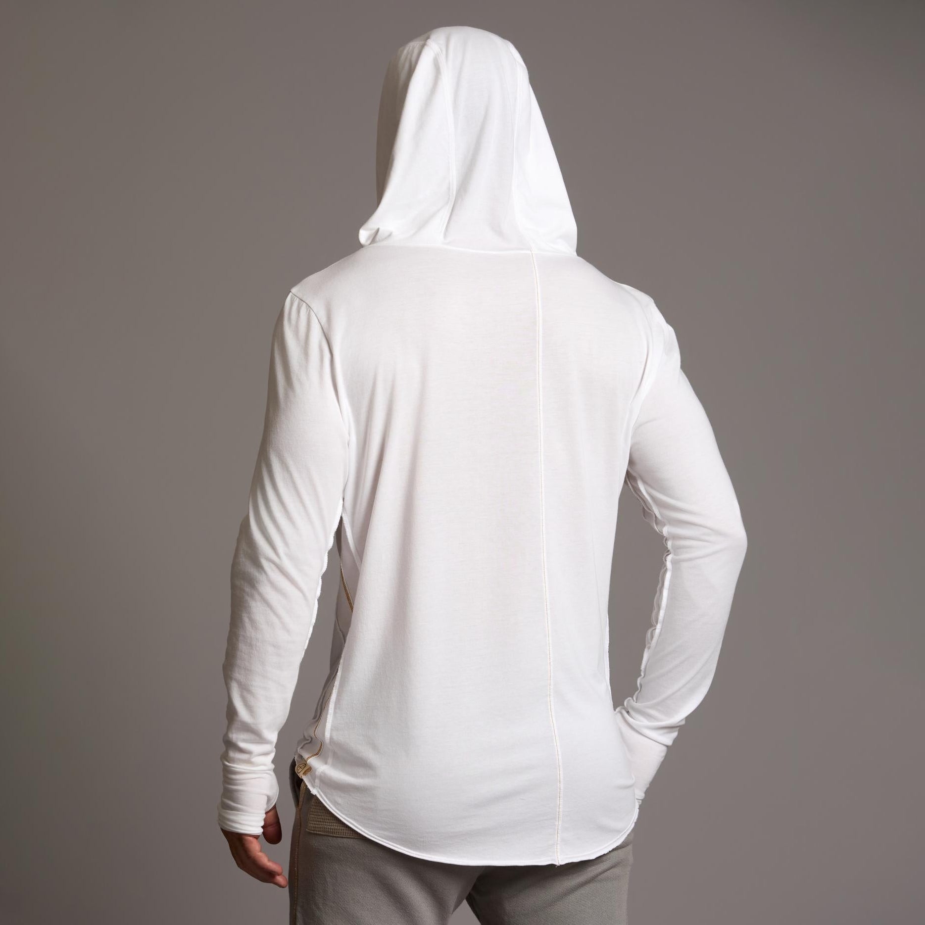 Man modeling white long-sleeve hooded tee