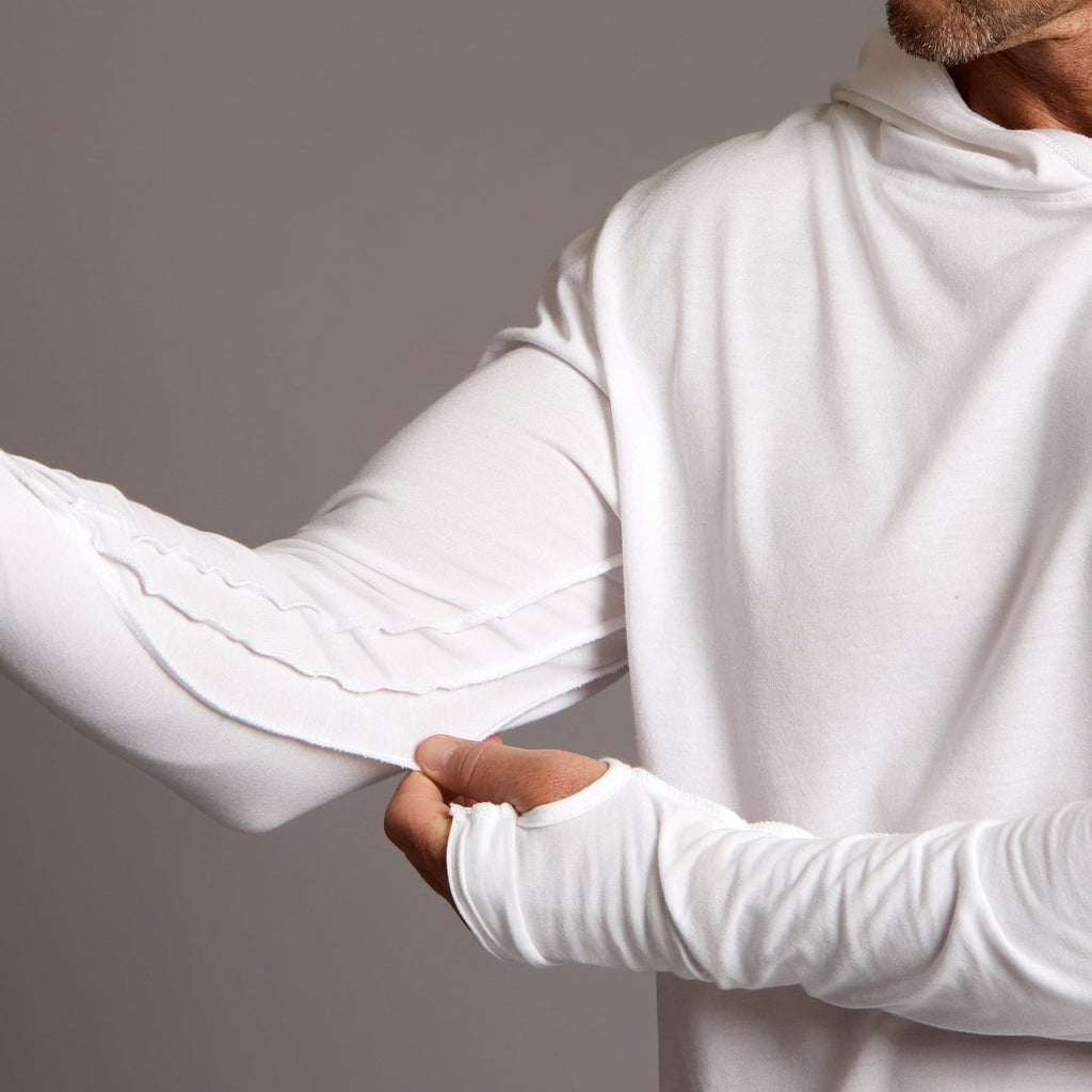 Man modeling white long-sleeve hooded tee