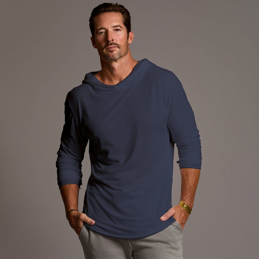 Man modeling blue long-sleeve hooded tee