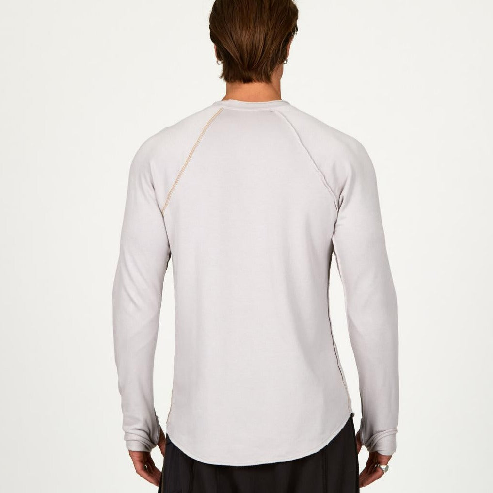 Male modeling white long sleeve raglan