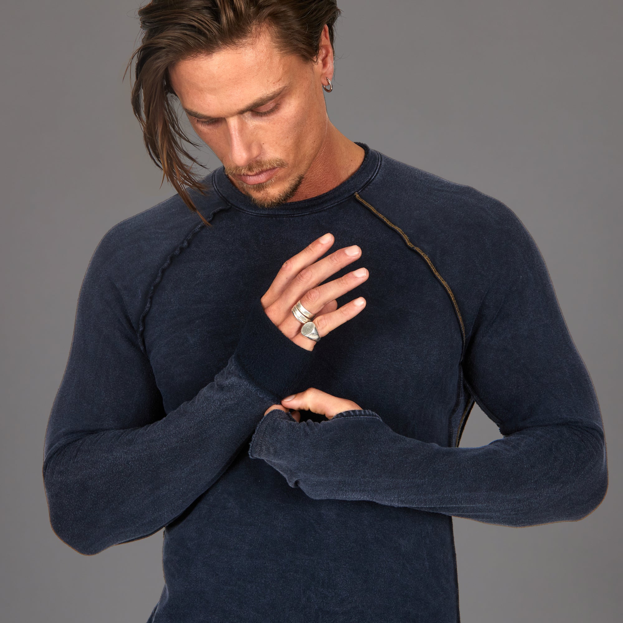 Male modeling dark blue long sleeve raglan