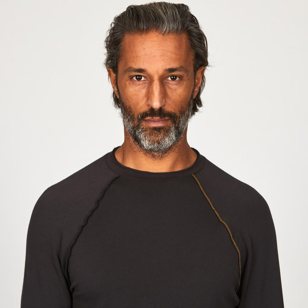 Male modeling dark long sleeve raglan