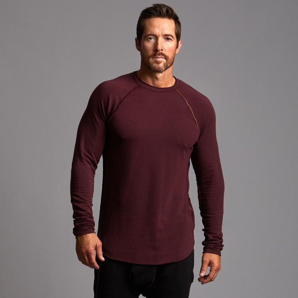 Male modeling red long sleeve raglan