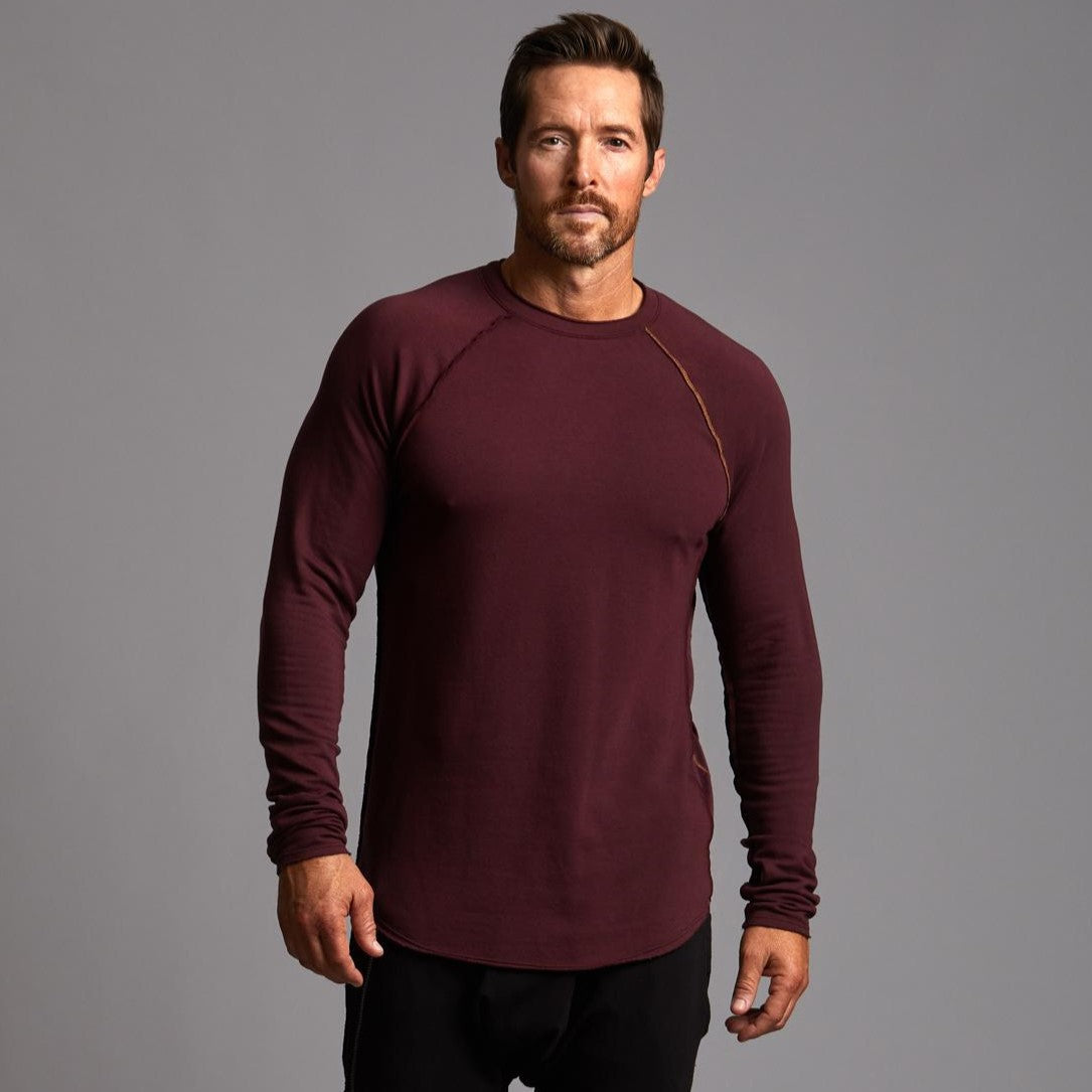 Male modeling red long sleeve raglan