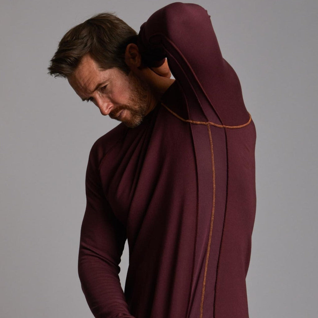 Male modeling purple long sleeve raglan