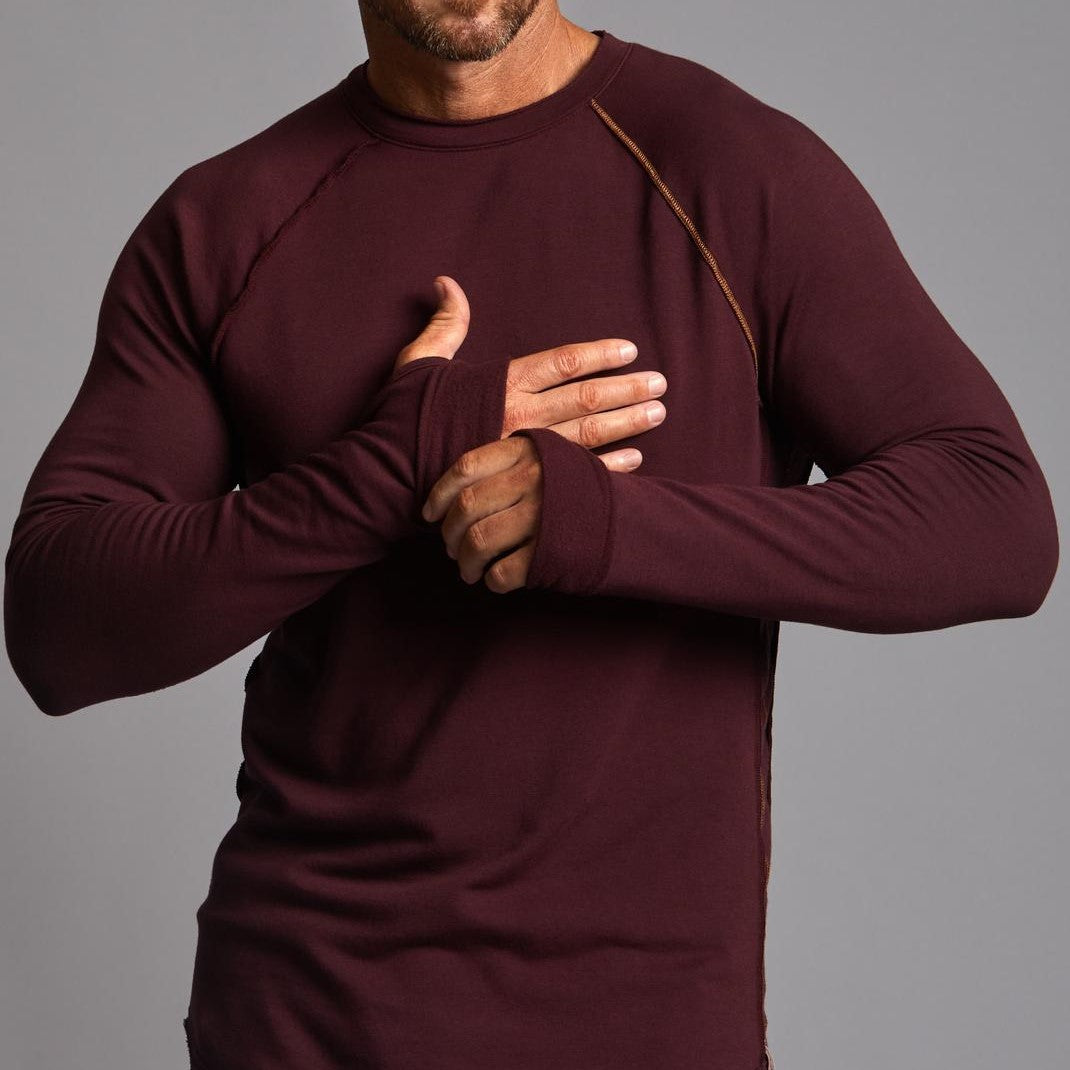 Male modeling red long sleeve raglan