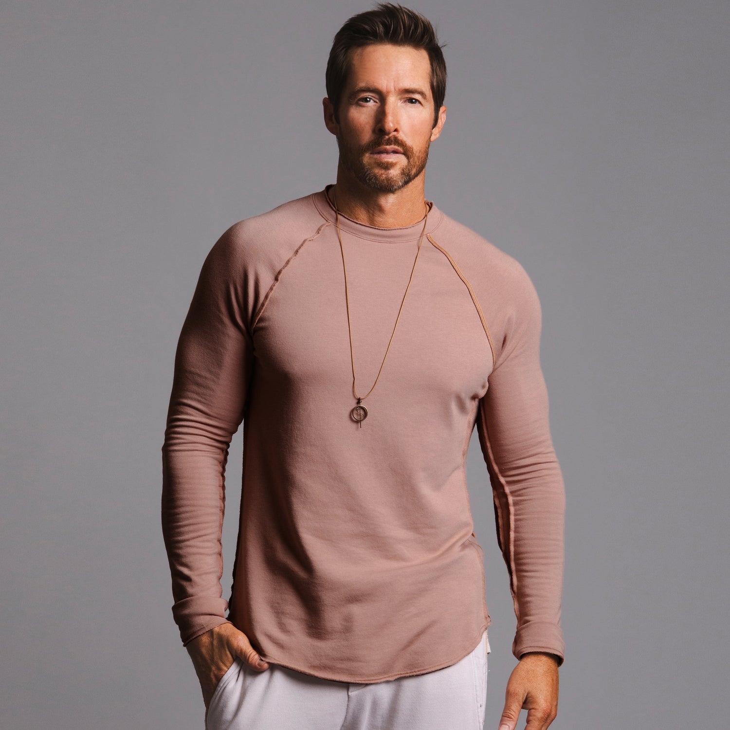 Male modeling terracotta long sleeve raglan