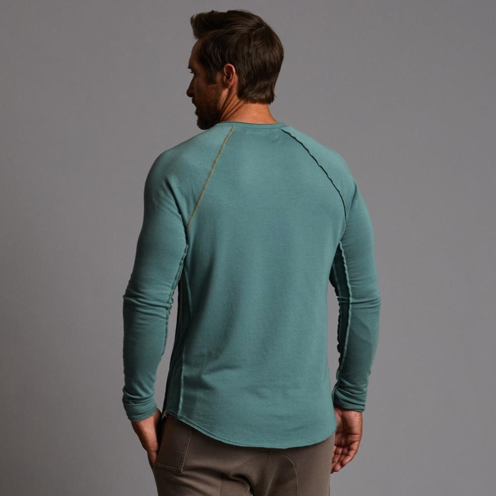 Male modeling teal long sleeve raglan