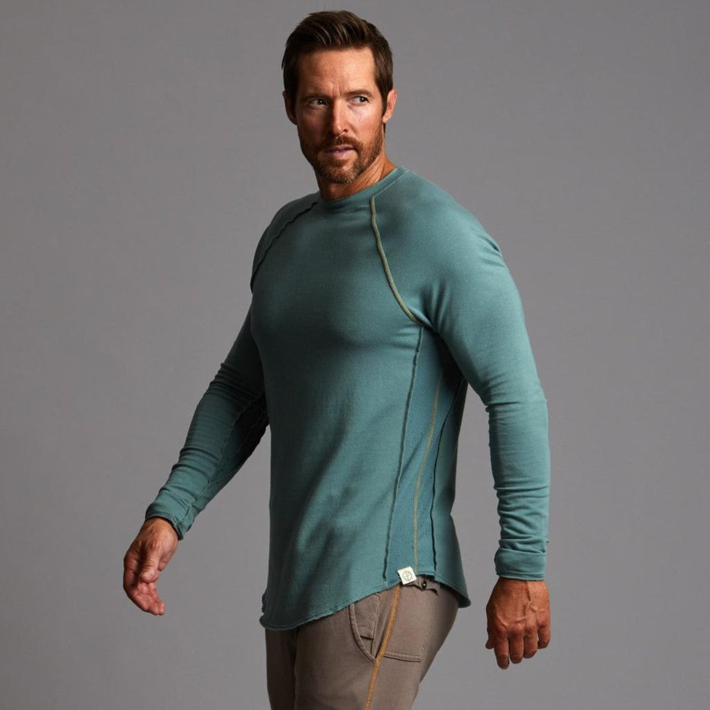 Male modeling teal long sleeve raglan
